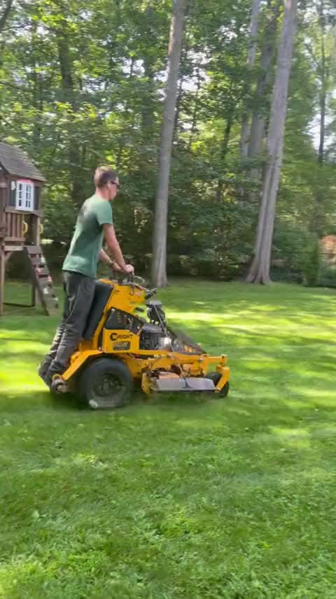 Mowing near a backyard shed