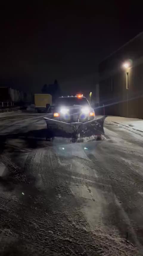 Driving up to a plow truck at night