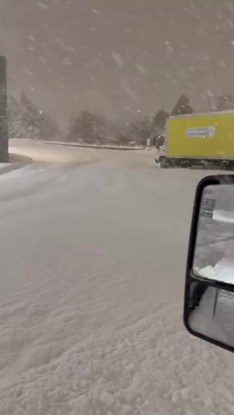 Heavy snowfall over a parking lot